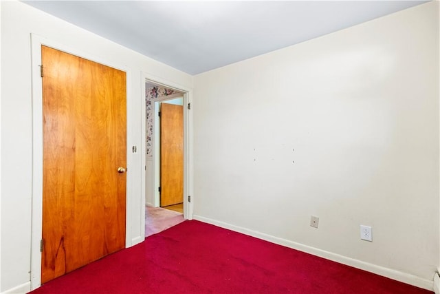 54 Glenwood Dr, North Kingstown, RI 02852 - carpeted empty room featuring baseboards and a baseboard heating unit