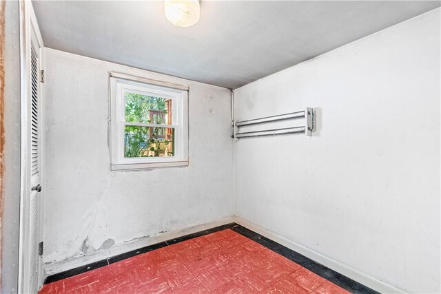 54 Glenwood Dr, North Kingstown, RI 02852 - empty room with dark flooring and baseboards