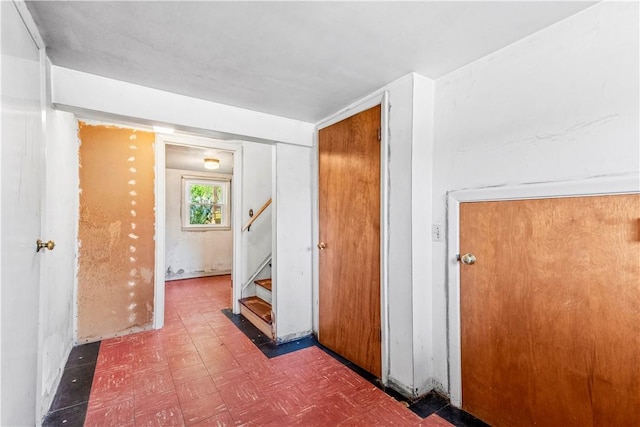 54 Glenwood Dr, North Kingstown, RI 02852 - corridor featuring tile patterned floors and stairs