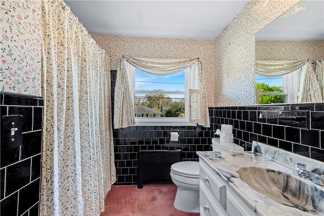 54 Glenwood Dr, North Kingstown, RI 02852 - bathroom with tile walls, toilet, wallpapered walls, radiator, and vanity