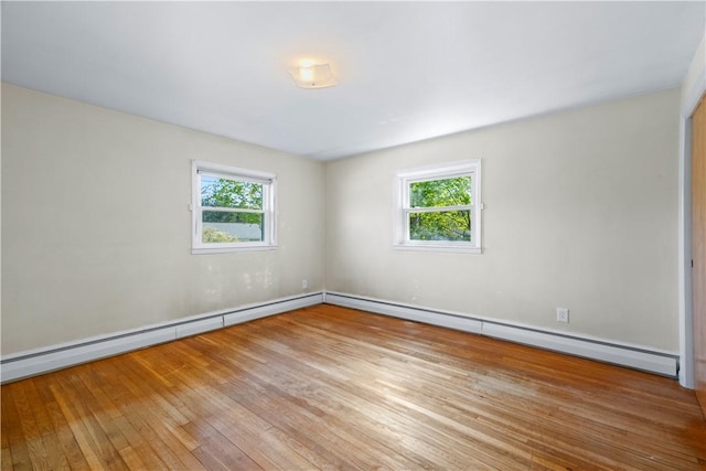 54 Glenwood Dr, North Kingstown, RI 02852 - unfurnished room featuring hardwood / wood-style flooring, plenty of natural light, and baseboards