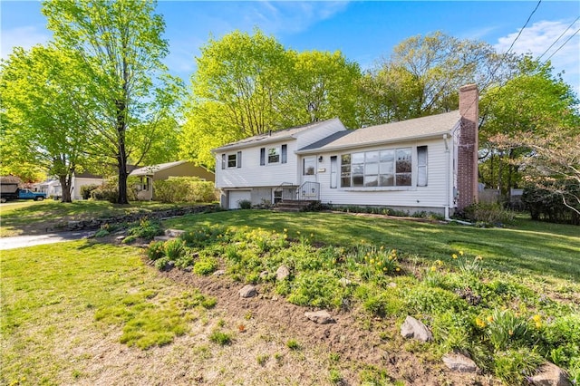 54 Glenwood Dr, North Kingstown, RI 02852 - split level home with a chimney, a garage, and a front yard