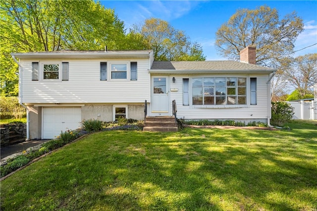 54 Glenwood Dr, North Kingstown, RI 02852 - split level home featuring a chimney, a garage, a front yard, entry steps, and asphalt driveway