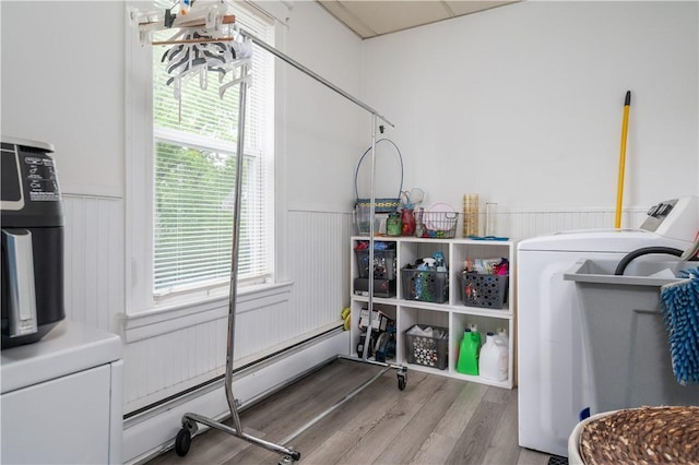645 Providence St, Woonsocket, RI 02895 - washroom featuring washer / clothes dryer, a wainscoted wall, wood finished floors, and a baseboard radiator