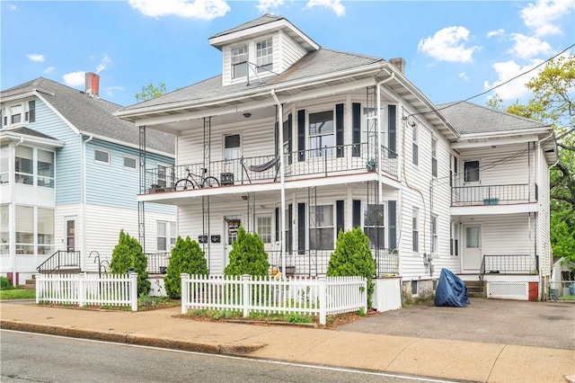 645 Providence St, Woonsocket, RI 02895 - view of front of house with a balcony and covered porch