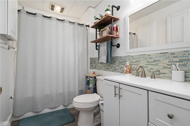 645 Providence St, Woonsocket, RI 02895 - full bath featuring decorative backsplash, toilet, vanity, and shower / tub combo with curtain