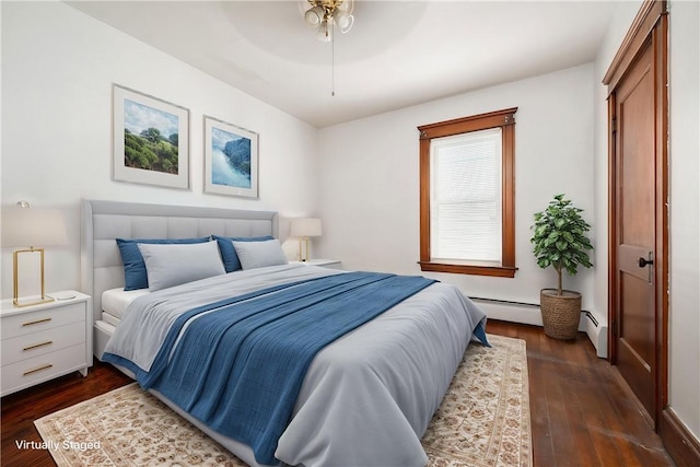 645 Providence St, Woonsocket, RI 02895 - bedroom featuring a baseboard radiator, dark wood-style flooring, and a ceiling fan