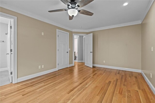 unfurnished bedroom featuring baseboards, ornamental molding, light wood-style floors, ensuite bath, and recessed lighting