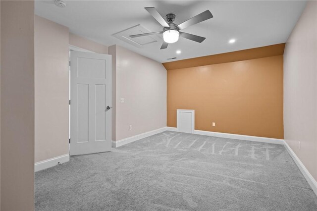 carpeted empty room featuring ceiling fan, baseboards, recessed lighting, and a smoke detector