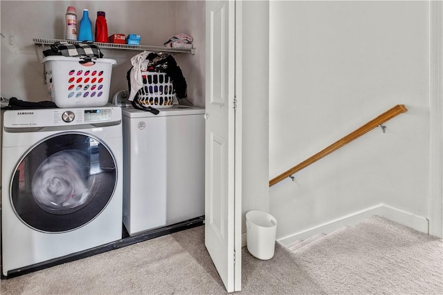 washroom featuring carpet and separate washer and dryer