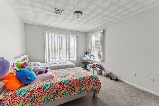 bedroom with carpet and baseboards
