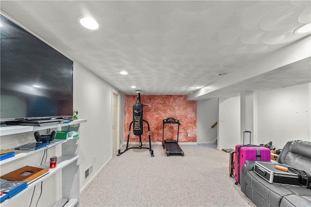 exercise room with carpet, recessed lighting, and baseboards