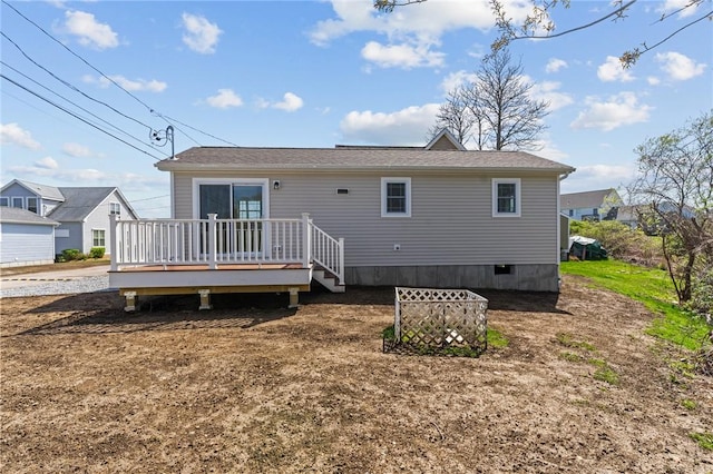 back of house with a wooden deck and crawl space