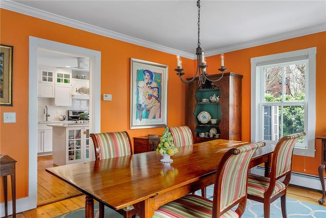15 Cross St, Newport, RI 02840 - dining room with light wood finished floors and ornamental molding