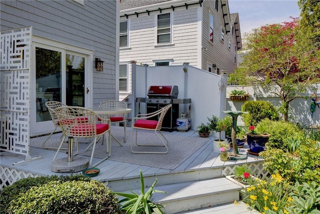15 Cross St, Newport, RI 02840 - view of patio featuring grilling area, outdoor dining area, a wooden deck, and fence