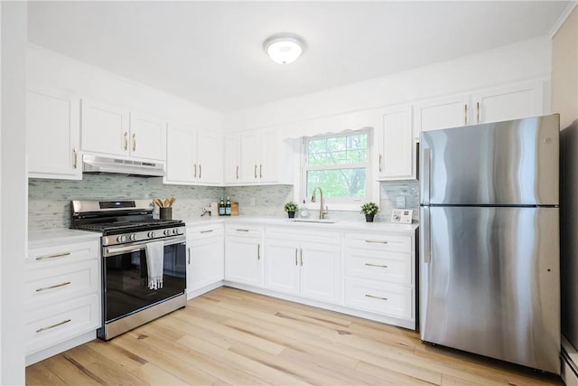 7 Maggio Ave, Westerly, RI 02891 - kitchen with stainless steel appliances, under cabinet range hood, a sink, light countertops, and ornamental molding