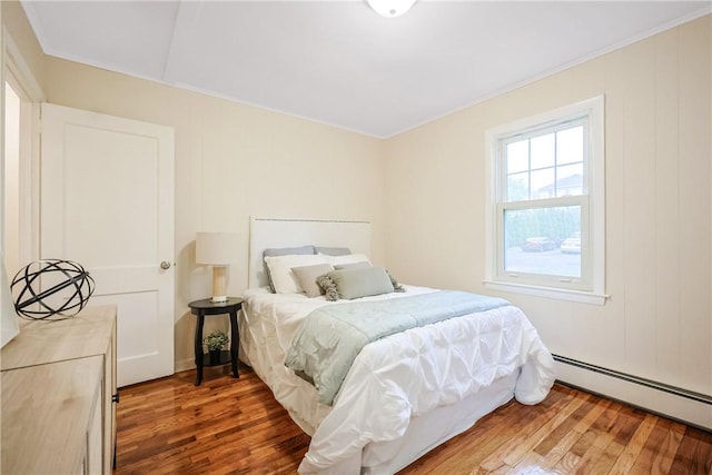 7 Maggio Ave, Westerly, RI 02891 - bedroom with wood finished floors, a baseboard heating unit, and crown molding