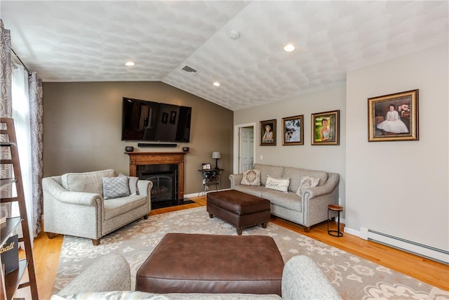 living area with baseboard heating, light wood finished floors, a fireplace with flush hearth, baseboards, and lofted ceiling