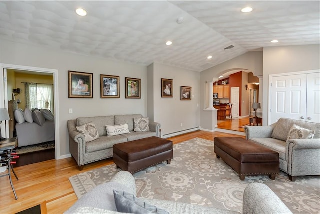 living area with a baseboard radiator, arched walkways, light wood-type flooring, recessed lighting, and lofted ceiling