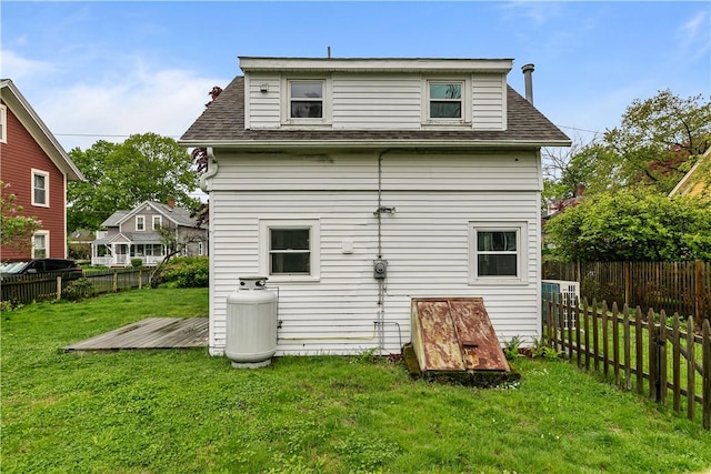 back of property featuring a deck and roof with shingles