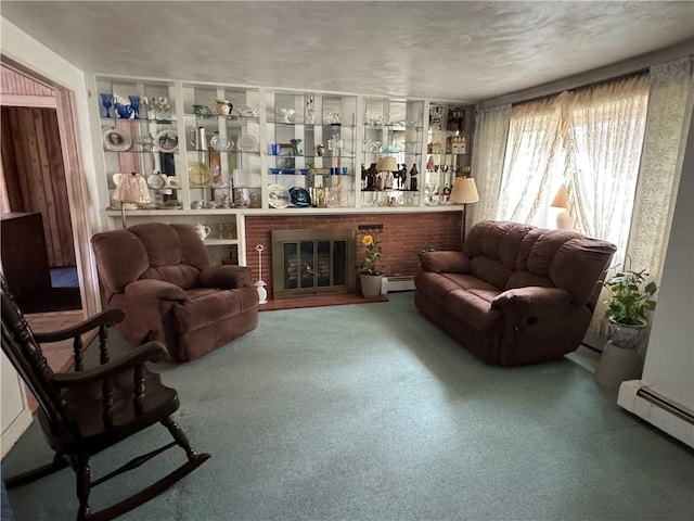 living area featuring a baseboard heating unit, carpet floors, and baseboard heating