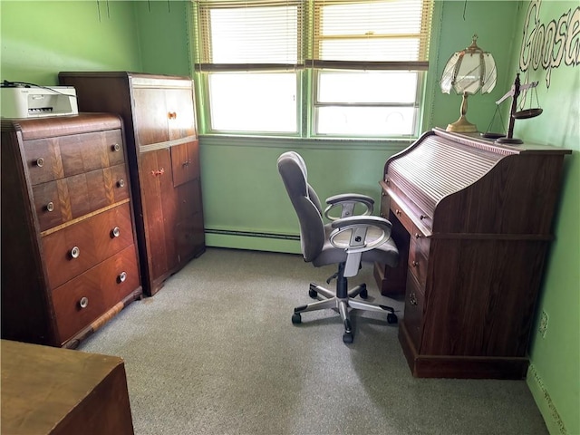 carpeted office space featuring a baseboard heating unit