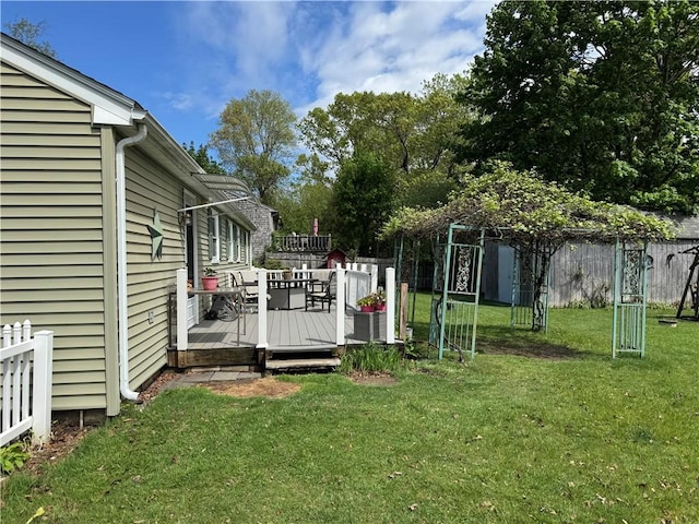 view of yard featuring a wooden deck