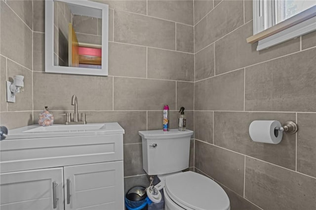 37 Pinewood Dr, North Providence, RI 02904 - bathroom with tile walls, toilet, and vanity