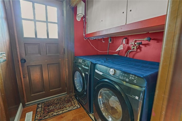 37 Pinewood Dr, North Providence, RI 02904 - washroom featuring cabinet space, washing machine and dryer, and wood finished floors