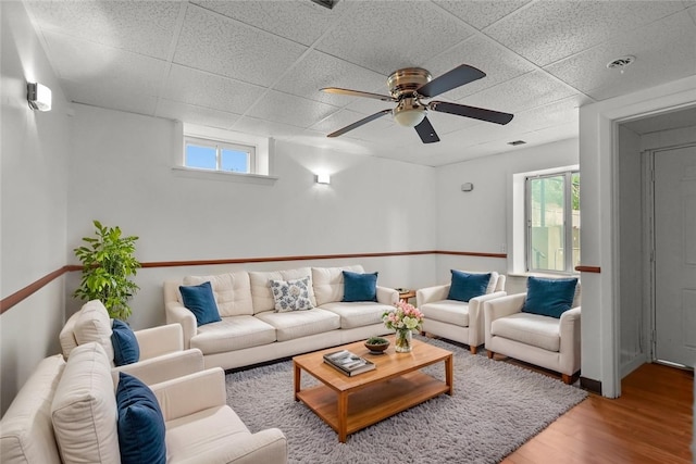 37 Pinewood Dr, North Providence, RI 02904 - living room featuring a drop ceiling, wood finished floors, plenty of natural light, ceiling fan, and baseboards