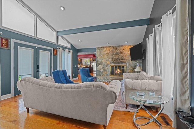 37 Pinewood Dr, North Providence, RI 02904 - living area with french doors, light wood-style flooring, a fireplace, and baseboards