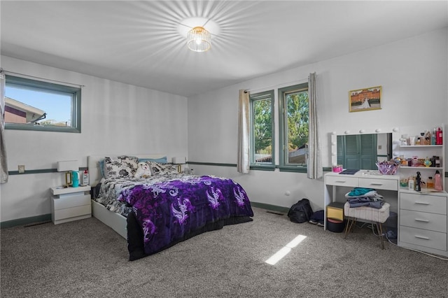 37 Pinewood Dr, North Providence, RI 02904 - carpeted bedroom with multiple windows and baseboards