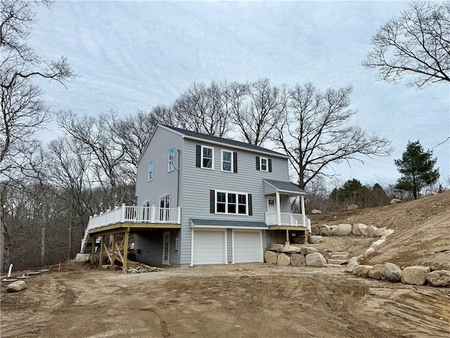 322 Post Rd, Westerly, RI 02891 - back of house featuring a garage, dirt driveway, and a deck