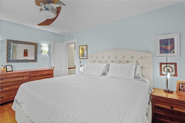 bedroom featuring wood finished floors and a ceiling fan