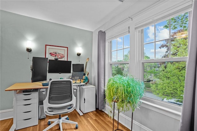 office space featuring wood finished floors and baseboards