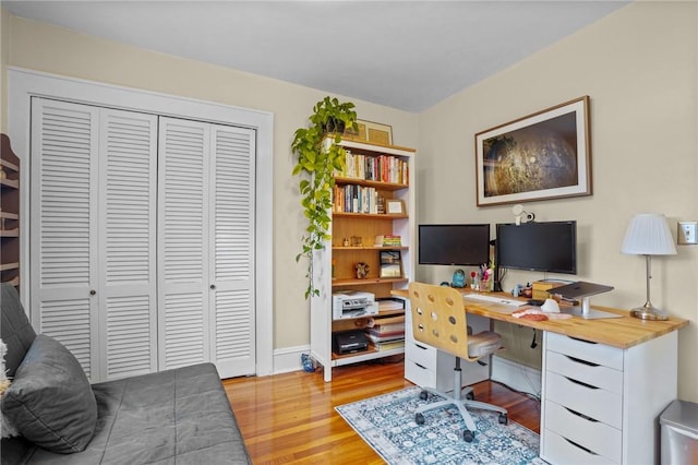 office with wood finished floors and baseboards