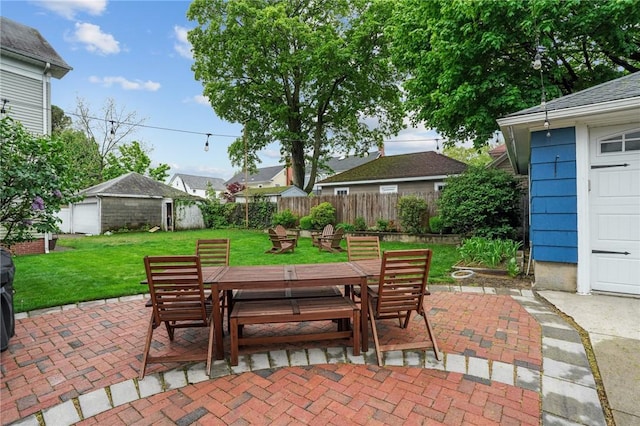 view of patio / terrace featuring outdoor dining space and an outdoor structure