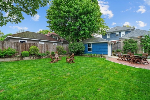 view of yard featuring a patio area and an outdoor structure