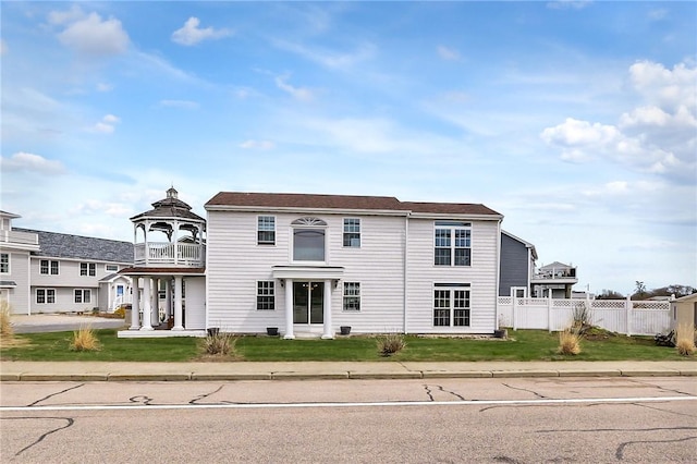 view of front of home with a balcony