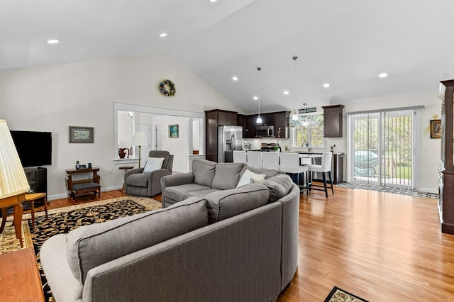 1740 Bulgarmarsh Rd, Tiverton, RI 02878 - living area with light wood-type flooring, recessed lighting, and high vaulted ceiling