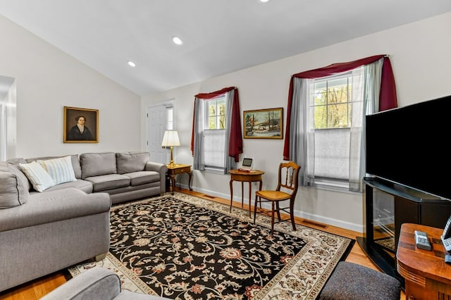 1740 Bulgarmarsh Rd, Tiverton, RI 02878 - living area featuring lofted ceiling, plenty of natural light, wood finished floors, recessed lighting, and baseboards