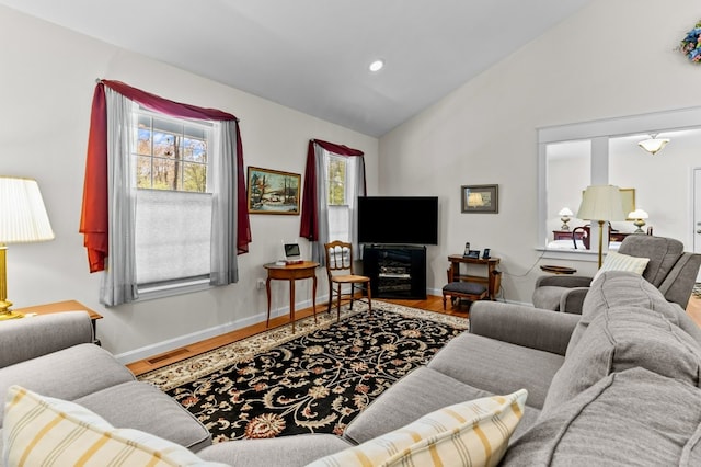 1740 Bulgarmarsh Rd, Tiverton, RI 02878 - living room featuring wood finished floors, baseboards, high vaulted ceiling, and recessed lighting