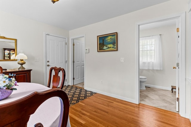 1740 Bulgarmarsh Rd, Tiverton, RI 02878 - bedroom with baseboards, ensuite bathroom, and light wood finished floors