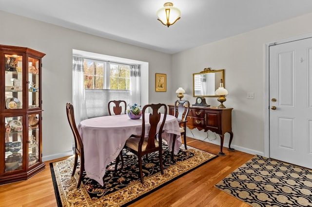 1740 Bulgarmarsh Rd, Tiverton, RI 02878 - dining area with light wood-style flooring and baseboards