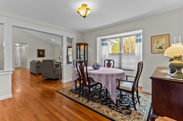 1740 Bulgarmarsh Rd, Tiverton, RI 02878 - dining space with light wood finished floors, baseboards, and lofted ceiling