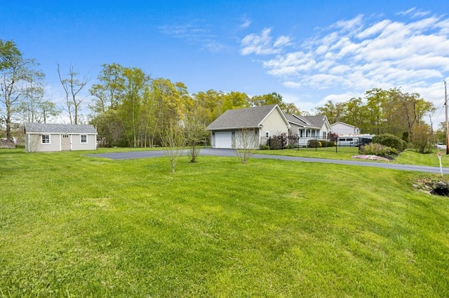 1740 Bulgarmarsh Rd, Tiverton, RI 02878 - view of yard featuring asphalt driveway and an attached garage