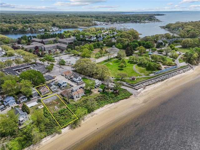 aerial view of property and surrounding area with a large body of water and property parcel outlined