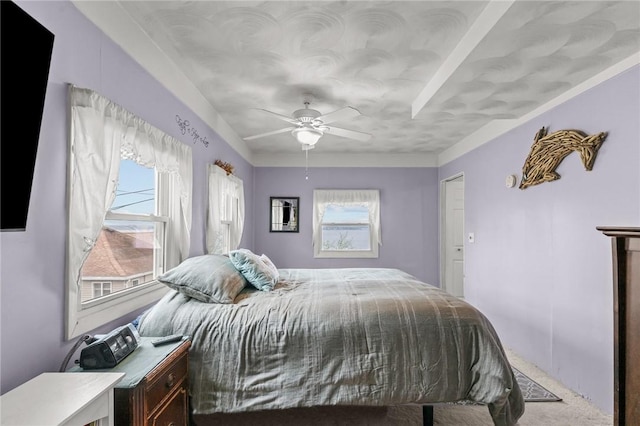 carpeted bedroom featuring ceiling fan