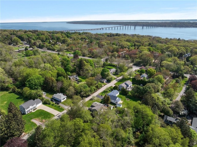 view of property location featuring a notable bridge and a nearby body of water