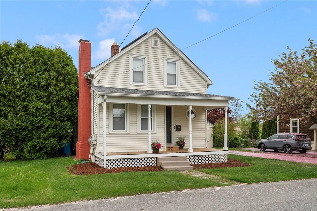 27 Hayes St, Cranston, RI 02920 - view of front of property featuring covered porch, a chimney, and a front lawn